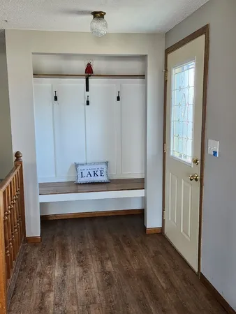 a view of wooden floor and a window