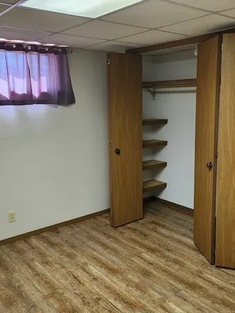 a bathroom with a sink toilet and a mirror