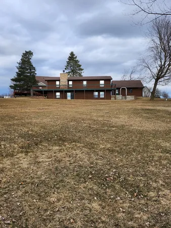 a view of house with outdoor space