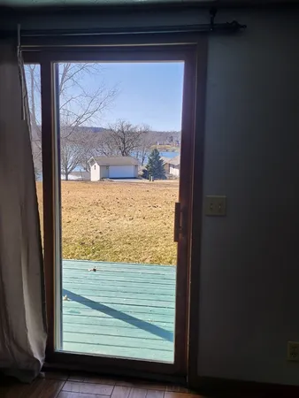 a view of balcony with yard