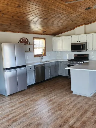 a view of a livingroom with wooden floor