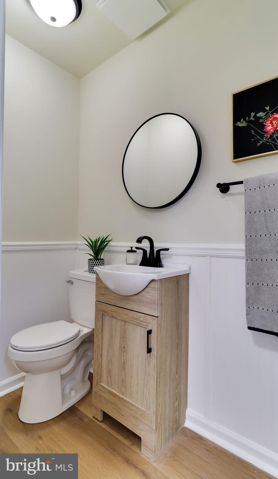 161 Warren Street Beverly, NJ 08010 - Photo 15 of 31 a bathroom with a sink a toilet and a mirror