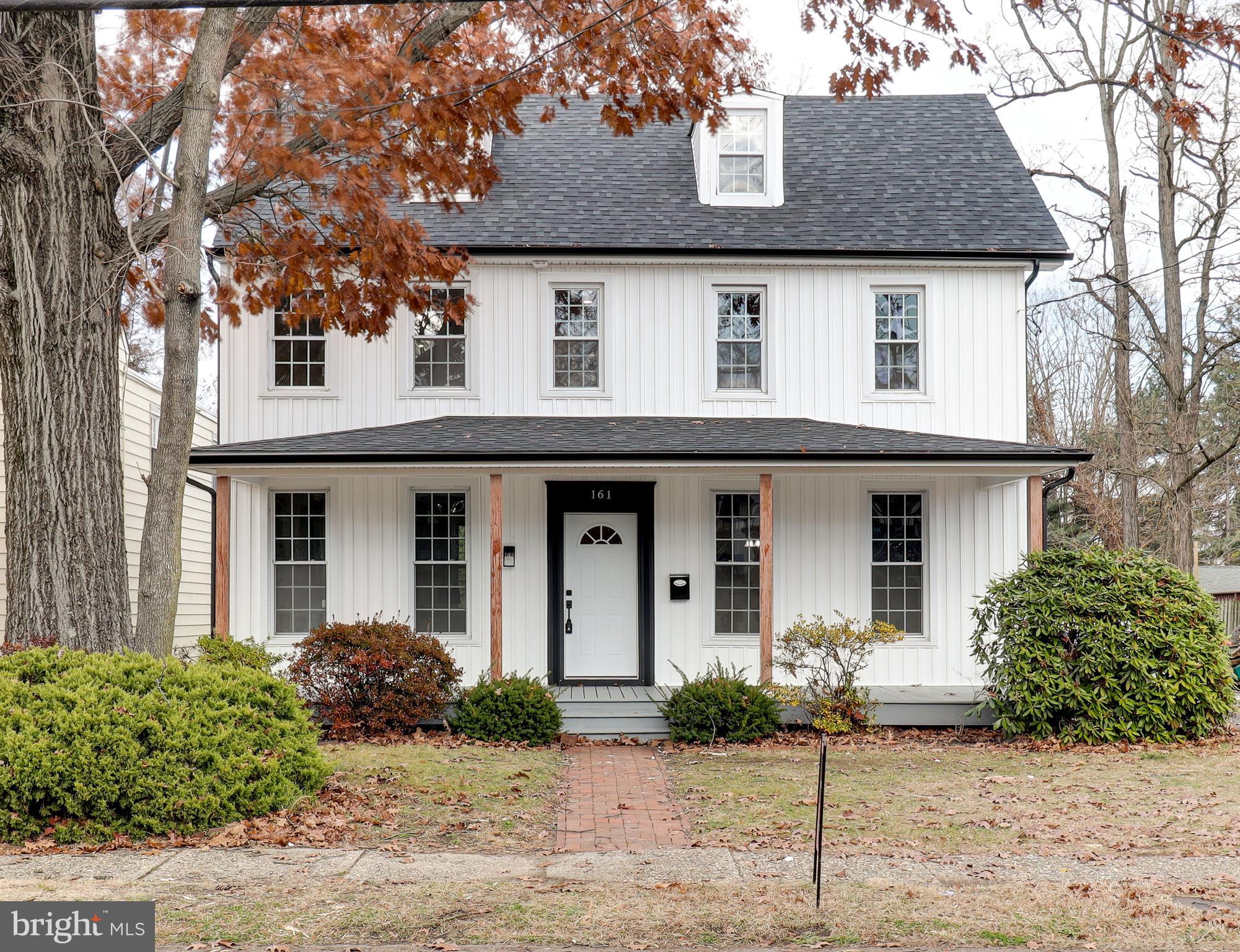 161 Warren Street Beverly, NJ 08010 - Photo 2 of 31 a front view of a house with garden