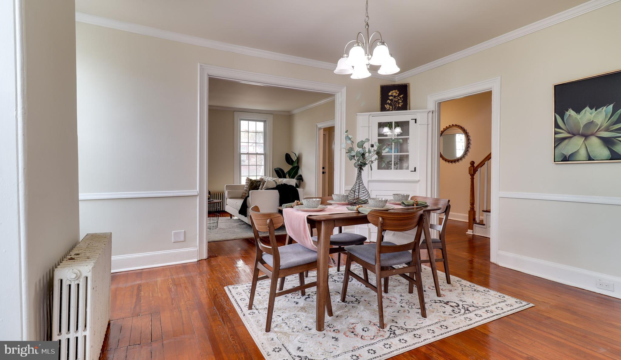 161 Warren Street Beverly, NJ 08010 - Photo 9 of 31 a view of a dining room with furniture and wooden floor