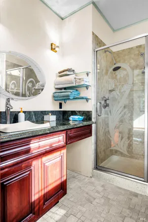 a kitchen with stainless steel appliances granite countertop wooden cabinets a refrigerator and a sink
