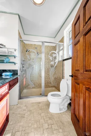 a kitchen with a sink cabinets and window