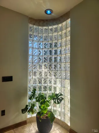 a bedroom with a large bed and a large window