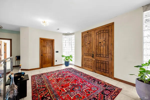 a bedroom with furniture and a window