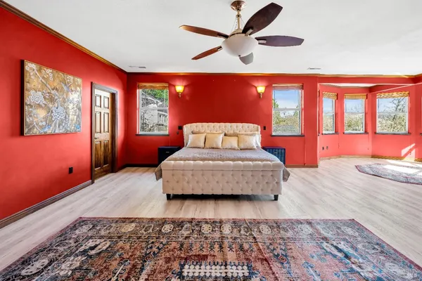 a living room with furniture and a kitchen