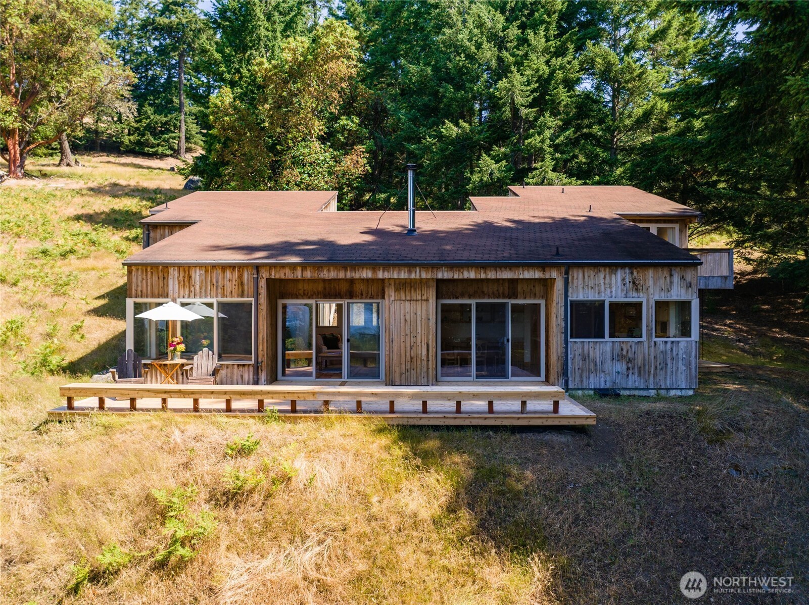 177 Harmon Ranch Hill Road Decatur Island, WA 98221 - Photo 1 of 37 a front view of a house with swimming pool