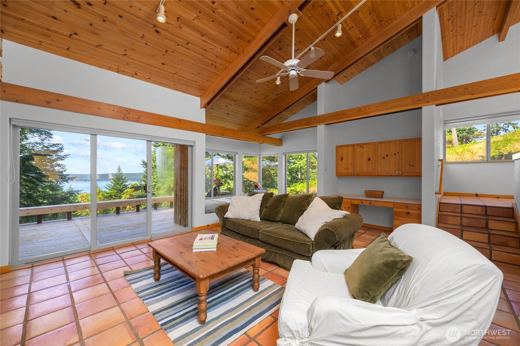 177 Harmon Ranch Hill Road Decatur Island, WA 98221 - Photo 11 of 37 a living room with furniture and a floor to ceiling window