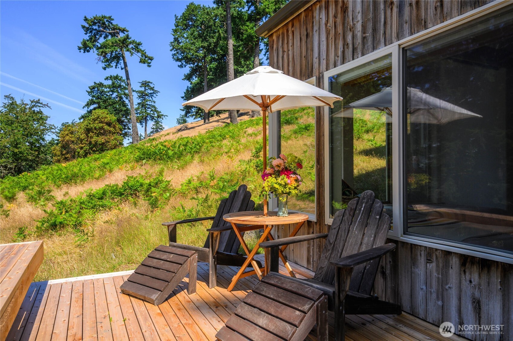 177 Harmon Ranch Hill Road Decatur Island, WA 98221 - Photo 21 of 37 a view of balcony with outdoor seating and wooden floor