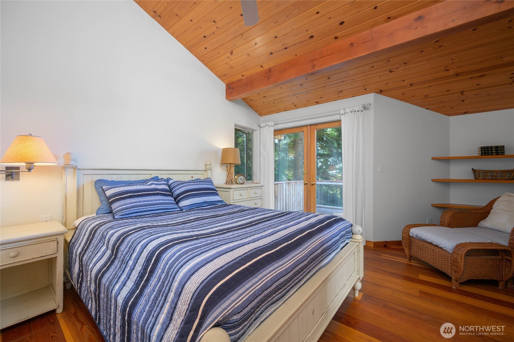 177 Harmon Ranch Hill Road Decatur Island, WA 98221 - Photo 27 of 37 a bedroom with a bed and wooden floor