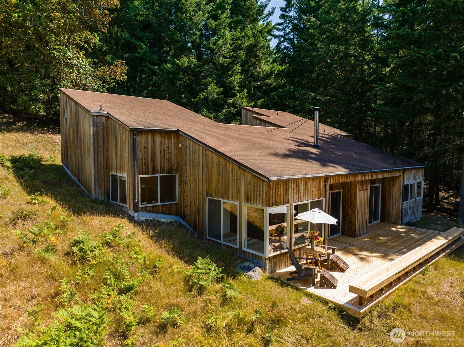 177 Harmon Ranch Hill Road Decatur Island, WA 98221 - Photo 31 of 37 a view of a patio with wooden floor and iron fence
