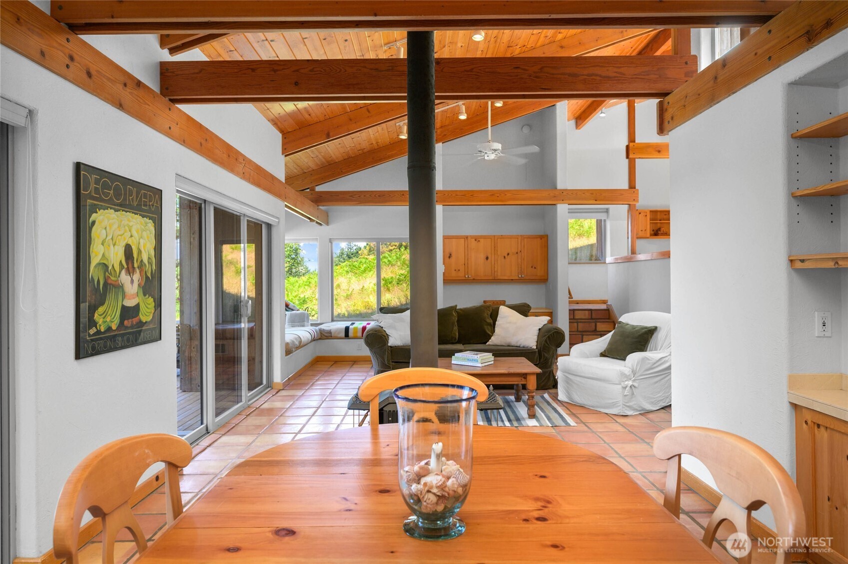 177 Harmon Ranch Hill Road Decatur Island, WA 98221 - Photo 8 of 37 a living room with fireplace furniture and a large window