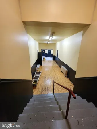 a view of a hallway with windows