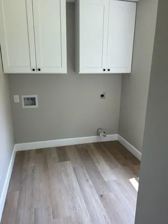 a view of cabinets and wooden floor