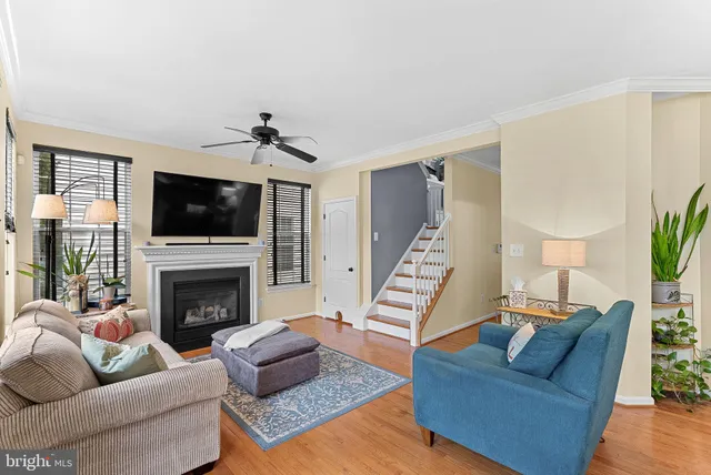 a living room with furniture fireplace and flat screen tv