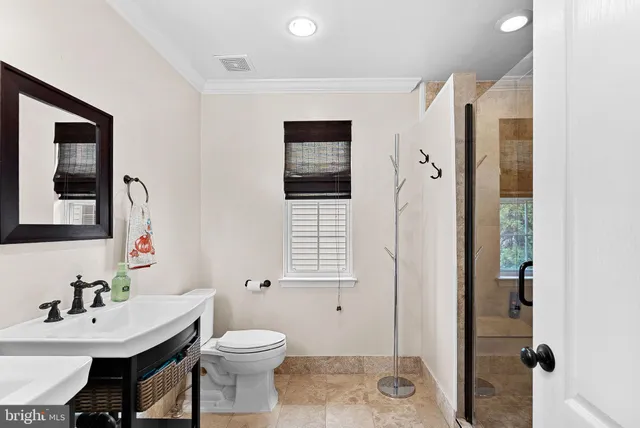 a bathroom with a shower and a sink