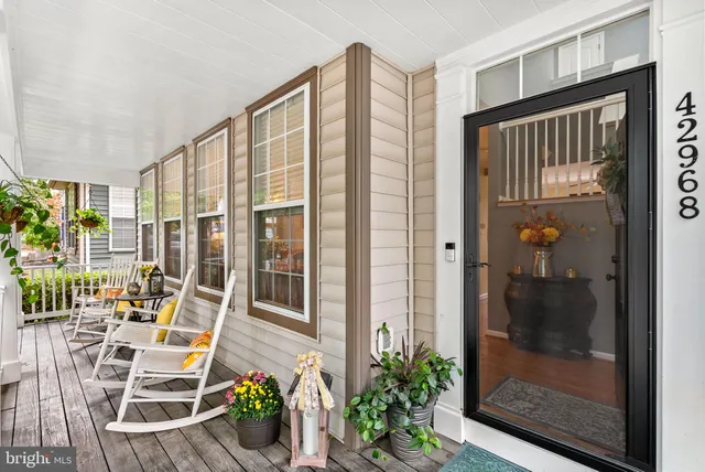 a view of hallway with livingroom and furniture