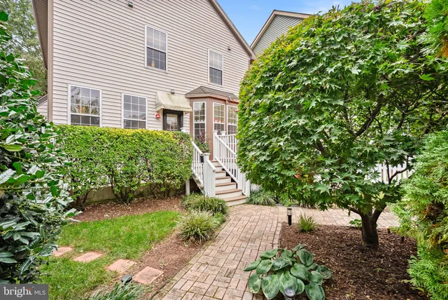 a small garden in the backyard of a house