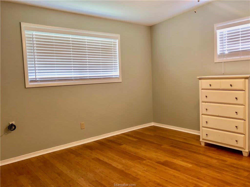 807 Vine Street Bryan, TX 77802 - Photo 14 of 17 a view of a room with wooden floor and window