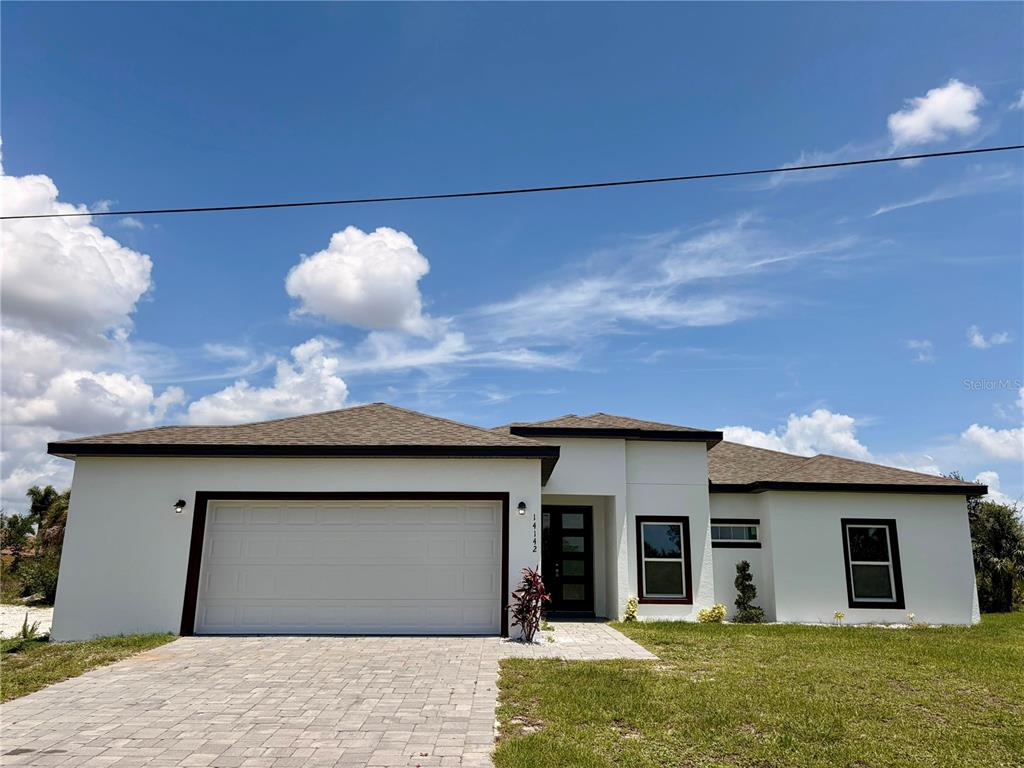 14142 Appleton Boulevard Port Charlotte, FL 33981 - Photo 26 of 26 a house view with a garden space
