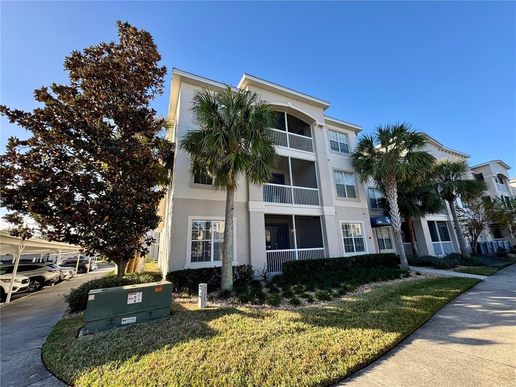 3300 Whitestone Circle, Unit 306 Kissimmee, FL 34741 - Photo 1 of 1 a front view of a house with a yard