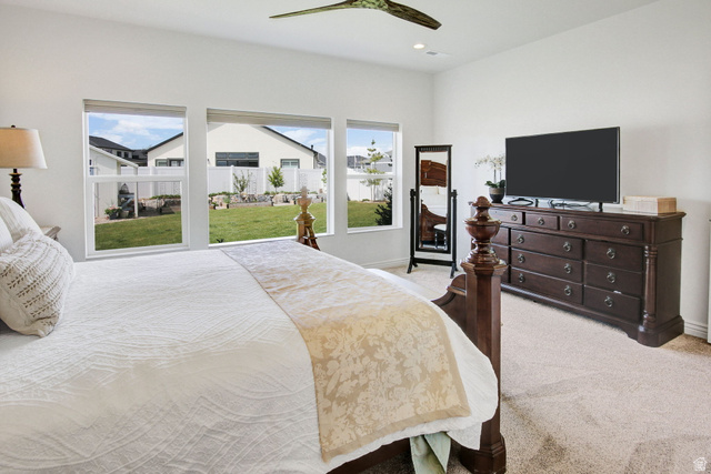 910 South 1700 West Layton, UT 84041 - Photo 14 of 26 Bedroom with light colored carpet and a ceiling fan