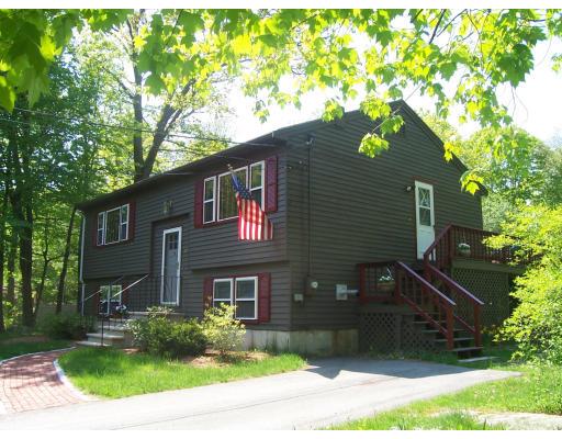 87 Forest Road Salisbury, MA 01952 - Photo 1 of 14 a front view of a house with a yard
