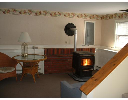 87 Forest Road Salisbury, MA 01952 - Photo 11 of 14 a living room with furniture and a fireplace