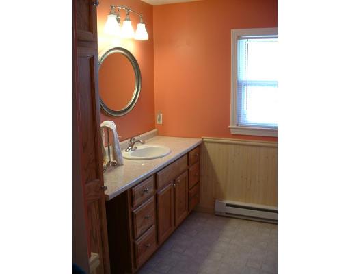 87 Forest Road Salisbury, MA 01952 - Photo 13 of 14 a bathroom with a sink and a mirror