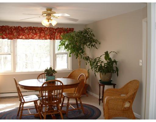 87 Forest Road Salisbury, MA 01952 - Photo 7 of 14 a view of a dining room with furniture and chandelier