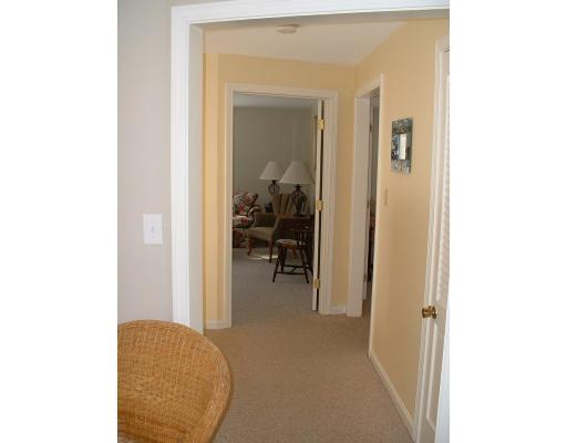 87 Forest Road Salisbury, MA 01952 - Photo 8 of 14 a view of a living room with a chair and a mirror
