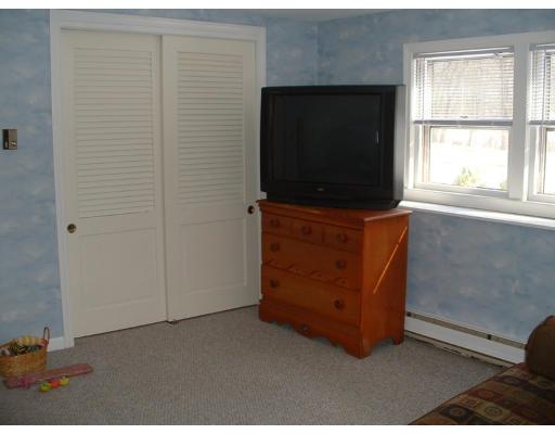 87 Forest Road Salisbury, MA 01952 - Photo 10 of 14 a living room with furniture and a flat screen tv