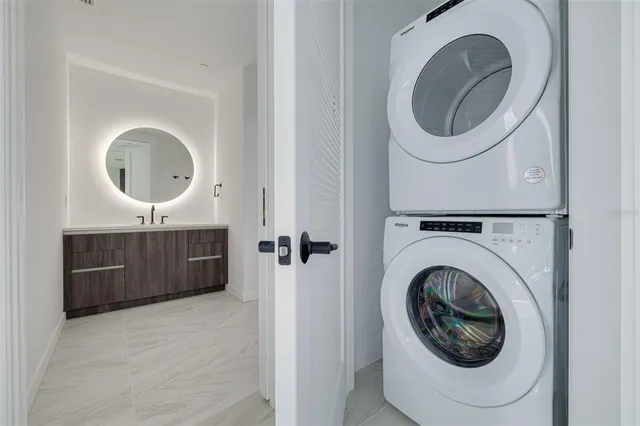 a view of a hallway with washer and dryer