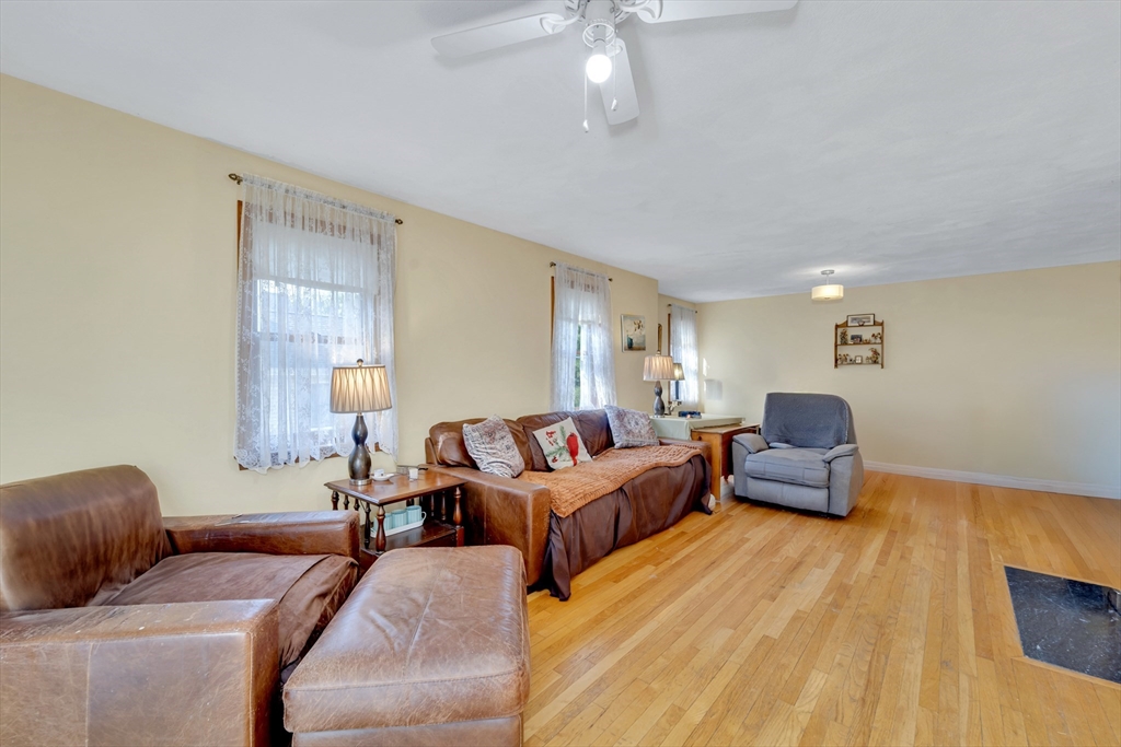 4 Rebecca Road Newton, MA 02465 - Photo 13 of 39 a living room with furniture and a wooden floor