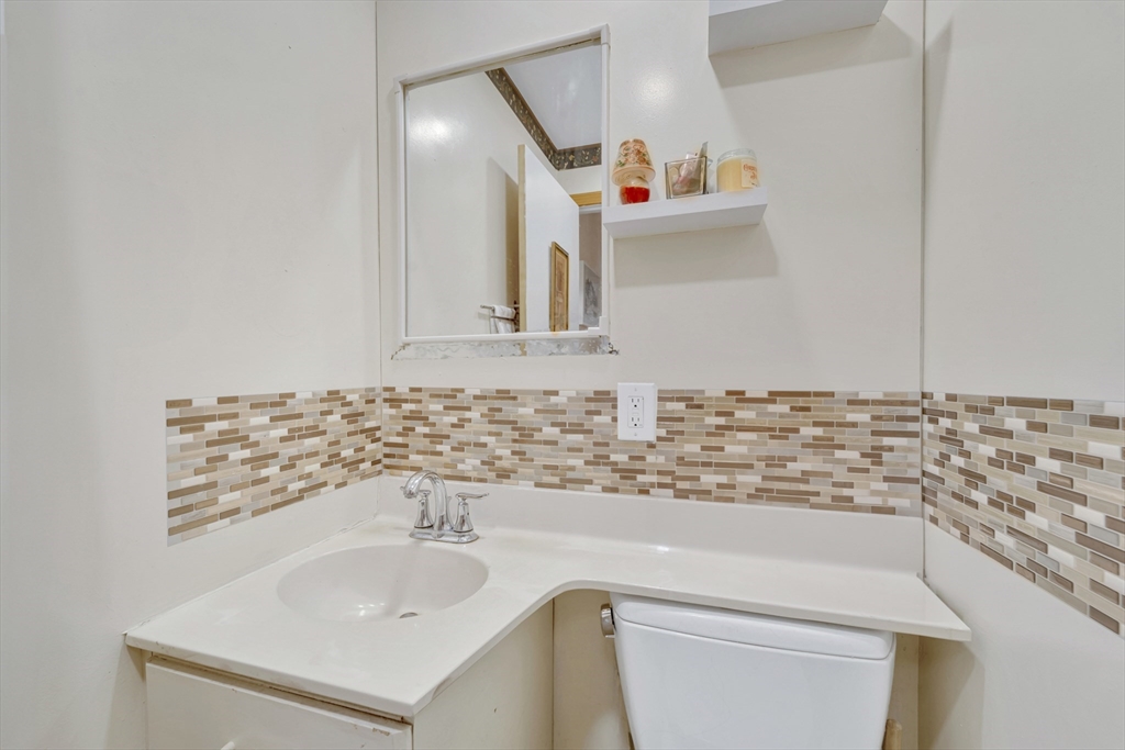 4 Rebecca Road Newton, MA 02465 - Photo 16 of 39 a bathroom with a sink and a mirror