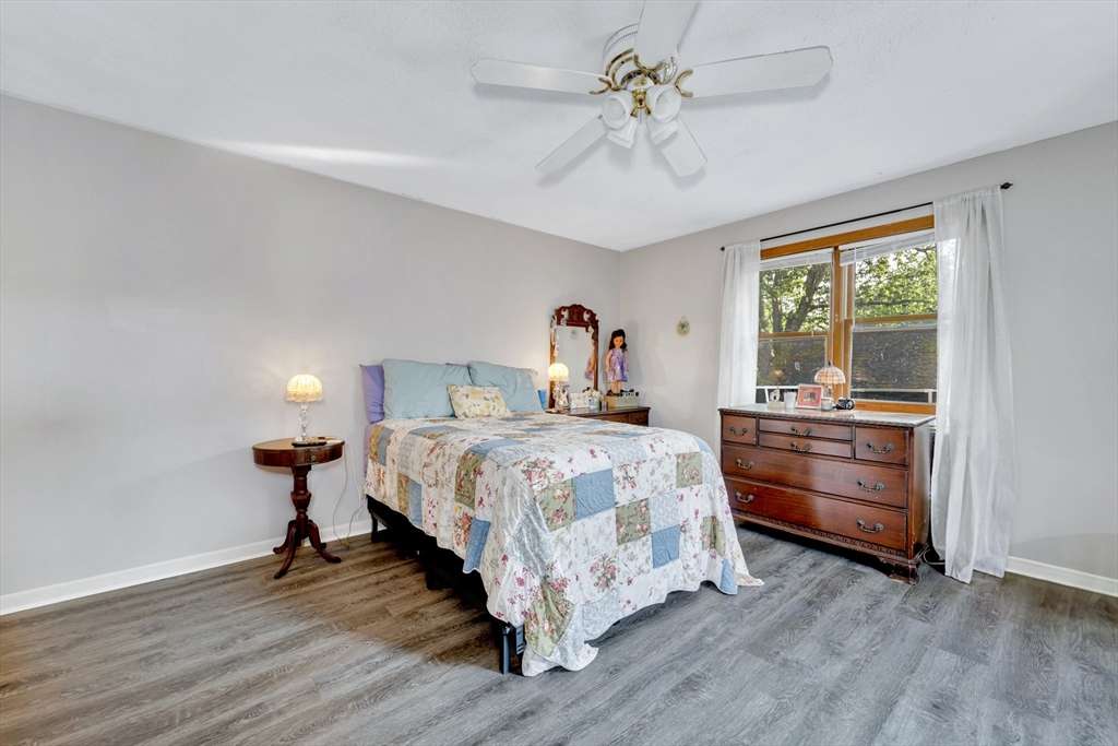 4 Rebecca Road Newton, MA 02465 - Photo 20 of 39 a bed room with a bed and a ceiling fan