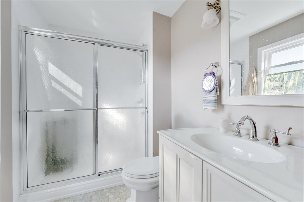 4 Rebecca Road Newton, MA 02465 - Photo 21 of 39 a bathroom with a sink and a mirror