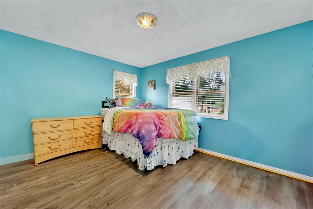 4 Rebecca Road Newton, MA 02465 - Photo 23 of 39 a bedroom with a bed and a window