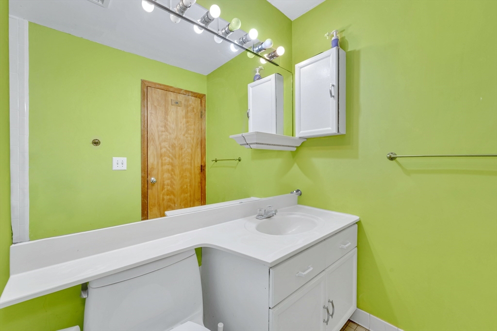 4 Rebecca Road Newton, MA 02465 - Photo 28 of 39 a bathroom with a sink and a mirror