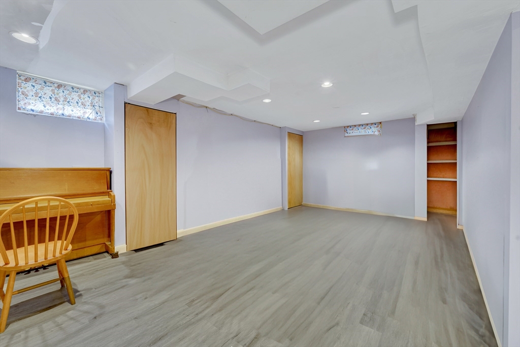 4 Rebecca Road Newton, MA 02465 - Photo 30 of 39 a view of an empty room with wooden floor and a window