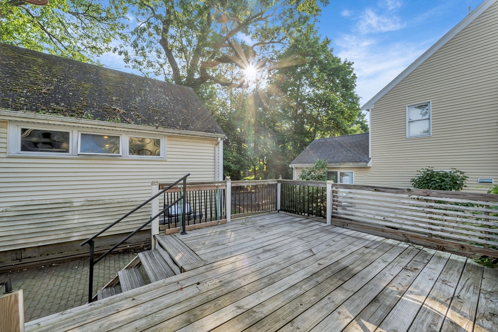 4 Rebecca Road Newton, MA 02465 - Photo 34 of 39 a view of a roof deck with wooden floor and fence