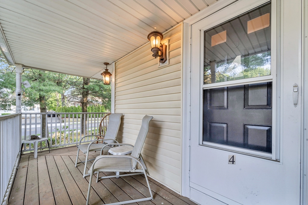 4 Rebecca Road Newton, MA 02465 - Photo 4 of 39 a view of balcony with furniture and wooden deck