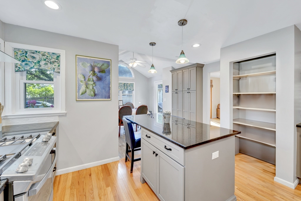 4 Rebecca Road Newton, MA 02465 - Photo 9 of 39 a kitchen with granite countertop a sink cabinets and wooden floor