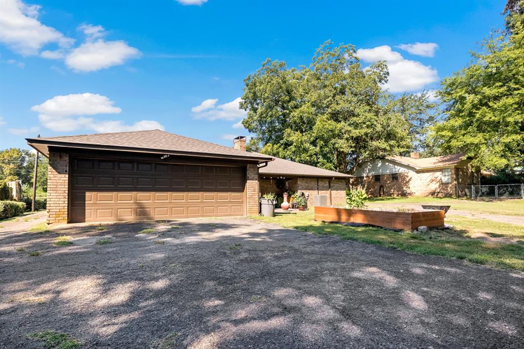 231 Quitman Street Pittsburg, TX 75686 - Photo 31 of 32 a house view with a outdoor space