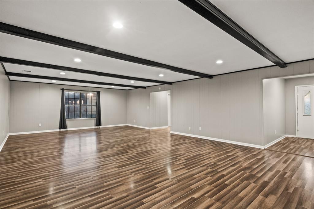 231 Quitman Street Pittsburg, TX 75686 - Photo 6 of 32 a view of an empty room