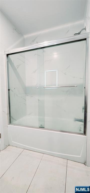 30 Howe Avenue, Unit 301 Passaic, NJ 07055 - Photo 10 of 10 a bathroom with a shower and a bath tub