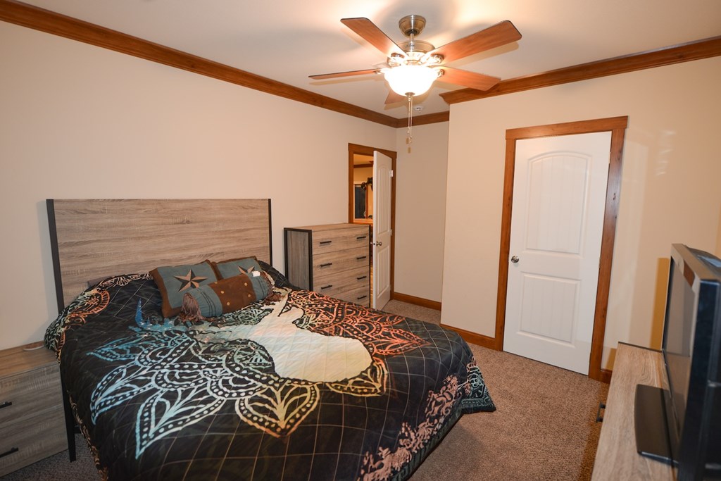 Undisclosed Address Rocksprings, TX 78880 - Photo 12 of 34 a bedroom with a bed and a flat screen tv